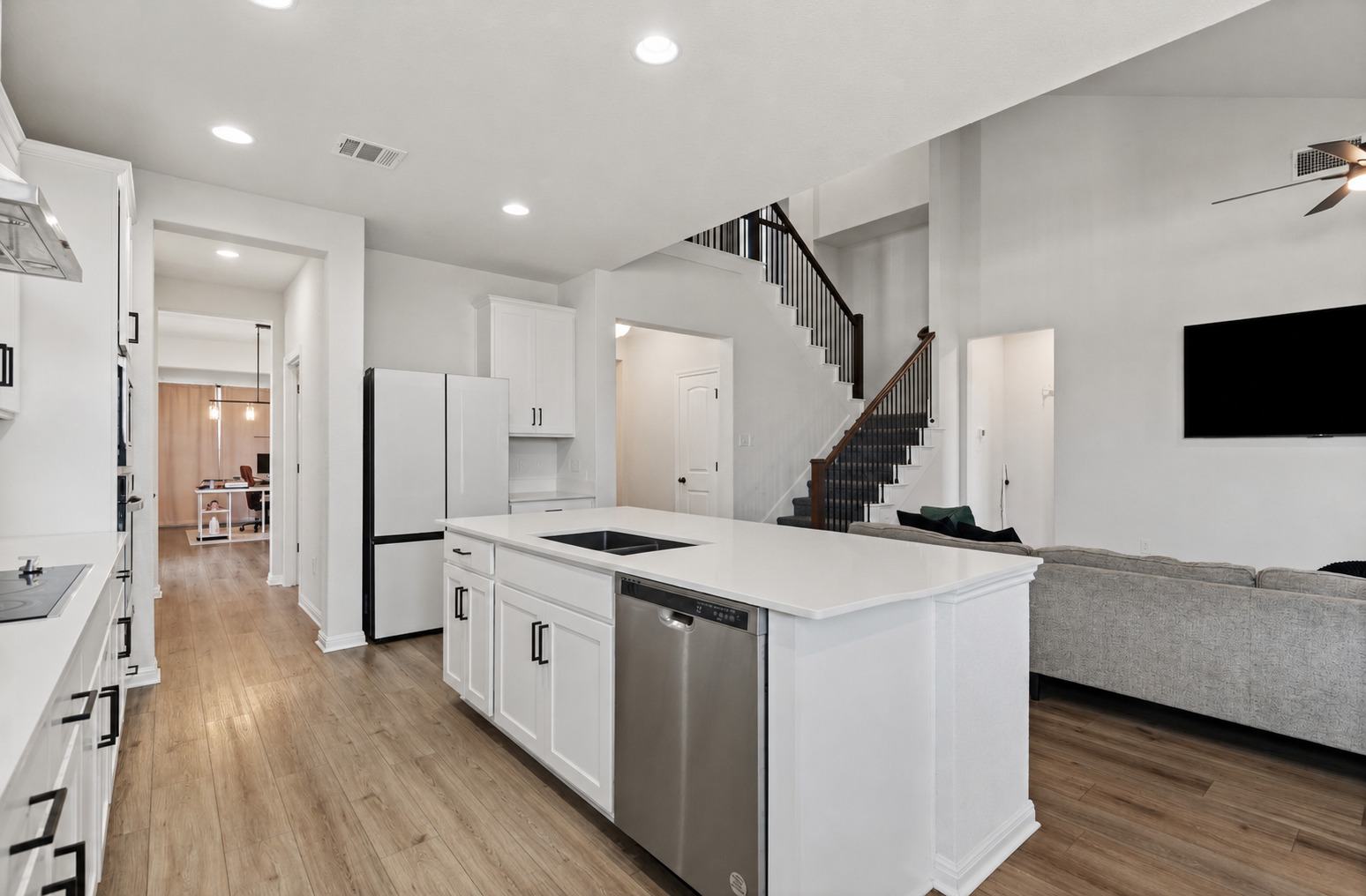 100 Panico Road Hutto, TX 78634 - Photo 6 of 28 A well-appointed kitchen island with sleek counters and a dishwasher, perfect for entertaining and everyday living.