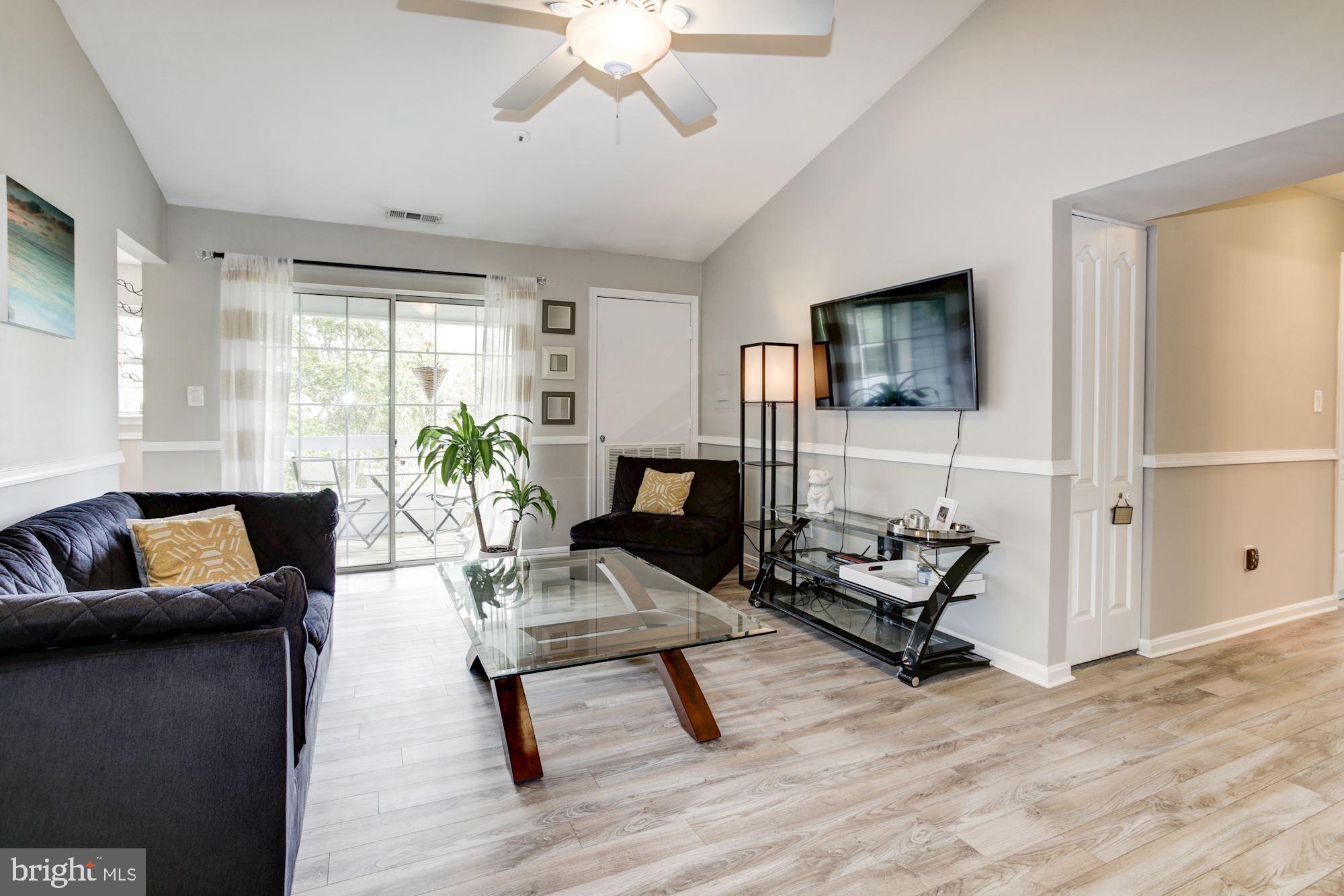 Family room with laminate flooring.