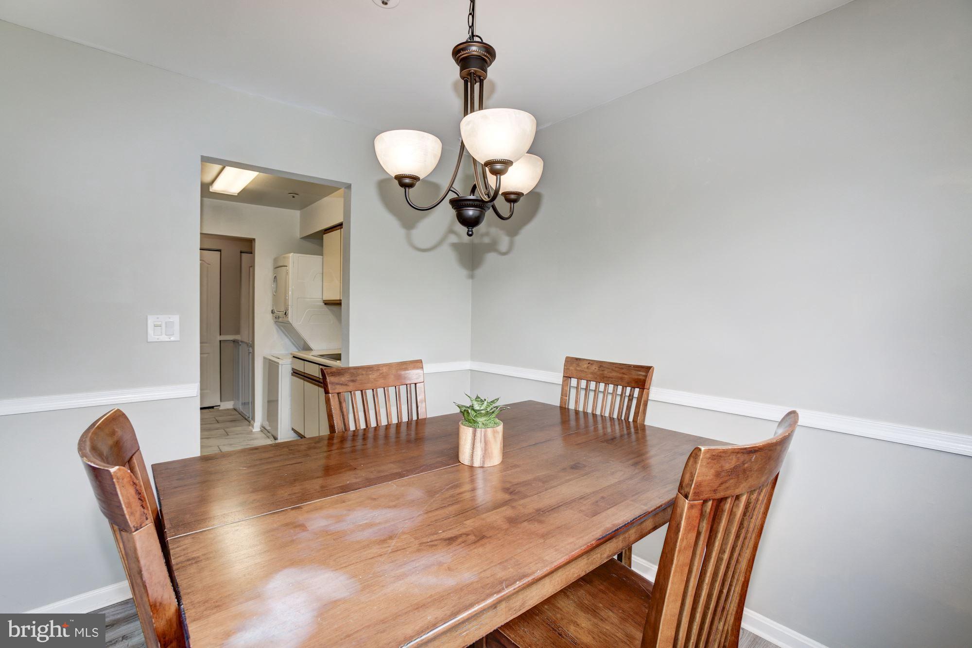 8611 Falls Run Road, Unit K Ellicott City, MD 21043 - Photo 11 of 22 Dining room featuring chair rails.