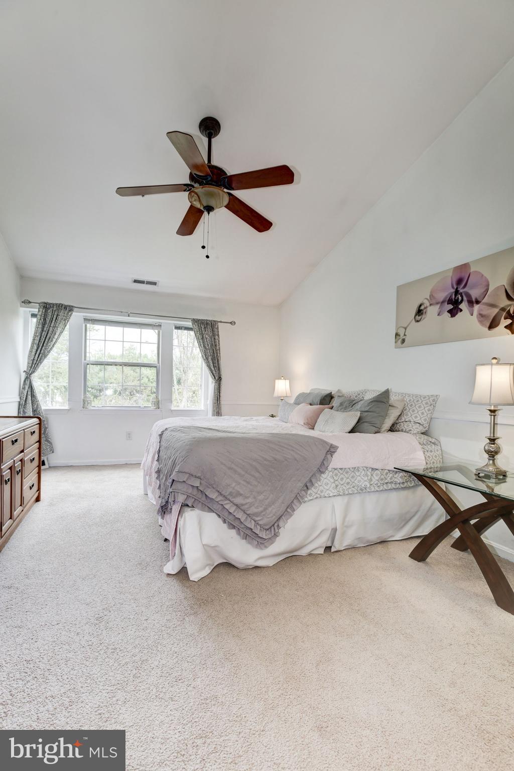 8611 Falls Run Road, Unit K Ellicott City, MD 21043 - Photo 13 of 22 Master bedroom with cathedral ceilings.