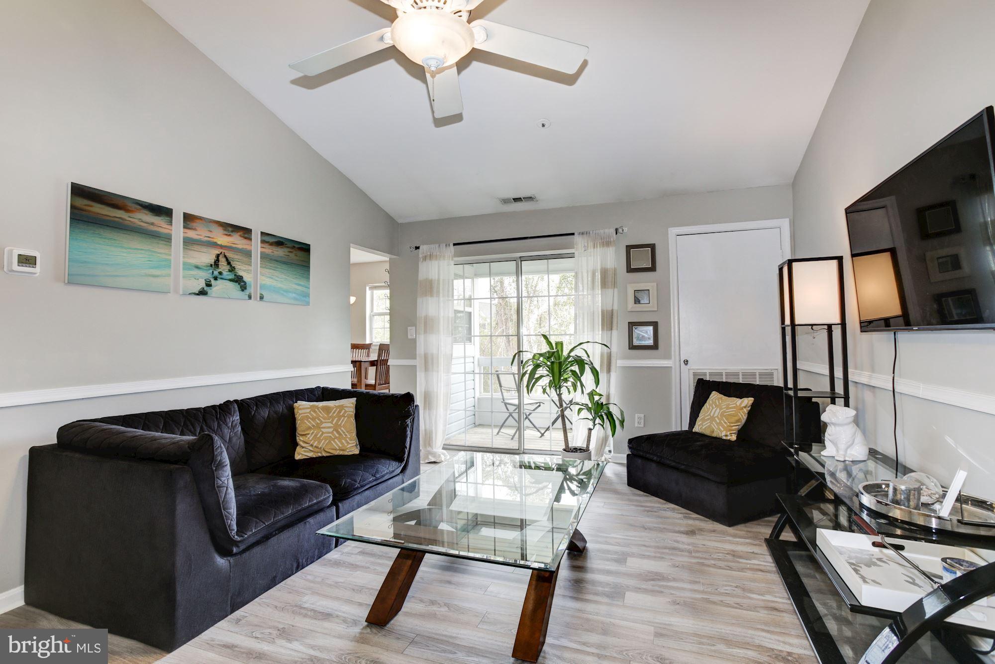 Family room with ceiling fan.