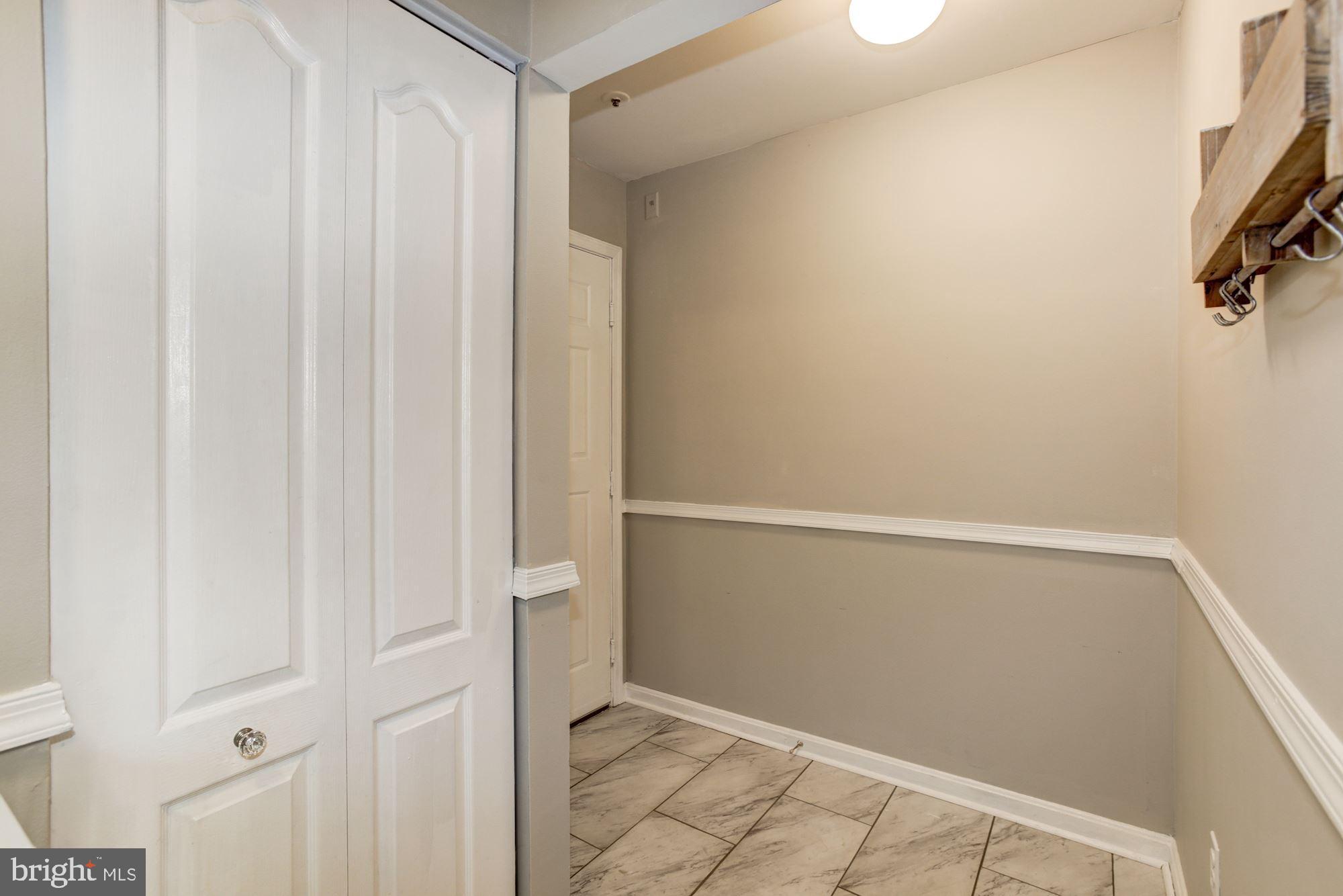 8611 Falls Run Road, Unit K Ellicott City, MD 21043 - Photo 21 of 22 Welcoming foyer with tile floors.