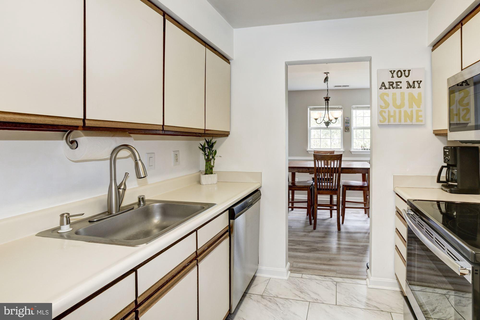 Kitchen with NEW stainless-steel appliances.