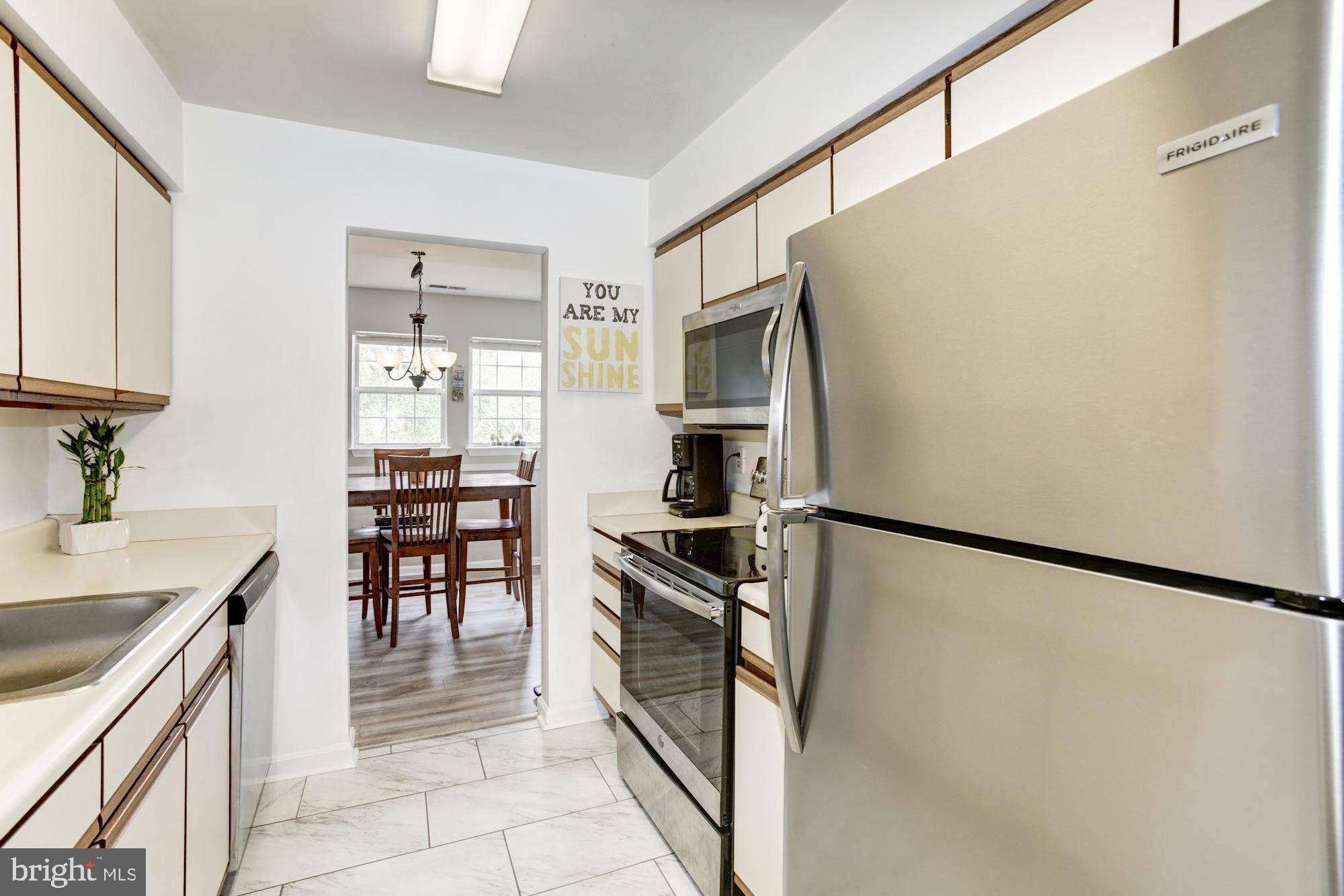 Kitchen with electric oven/range.