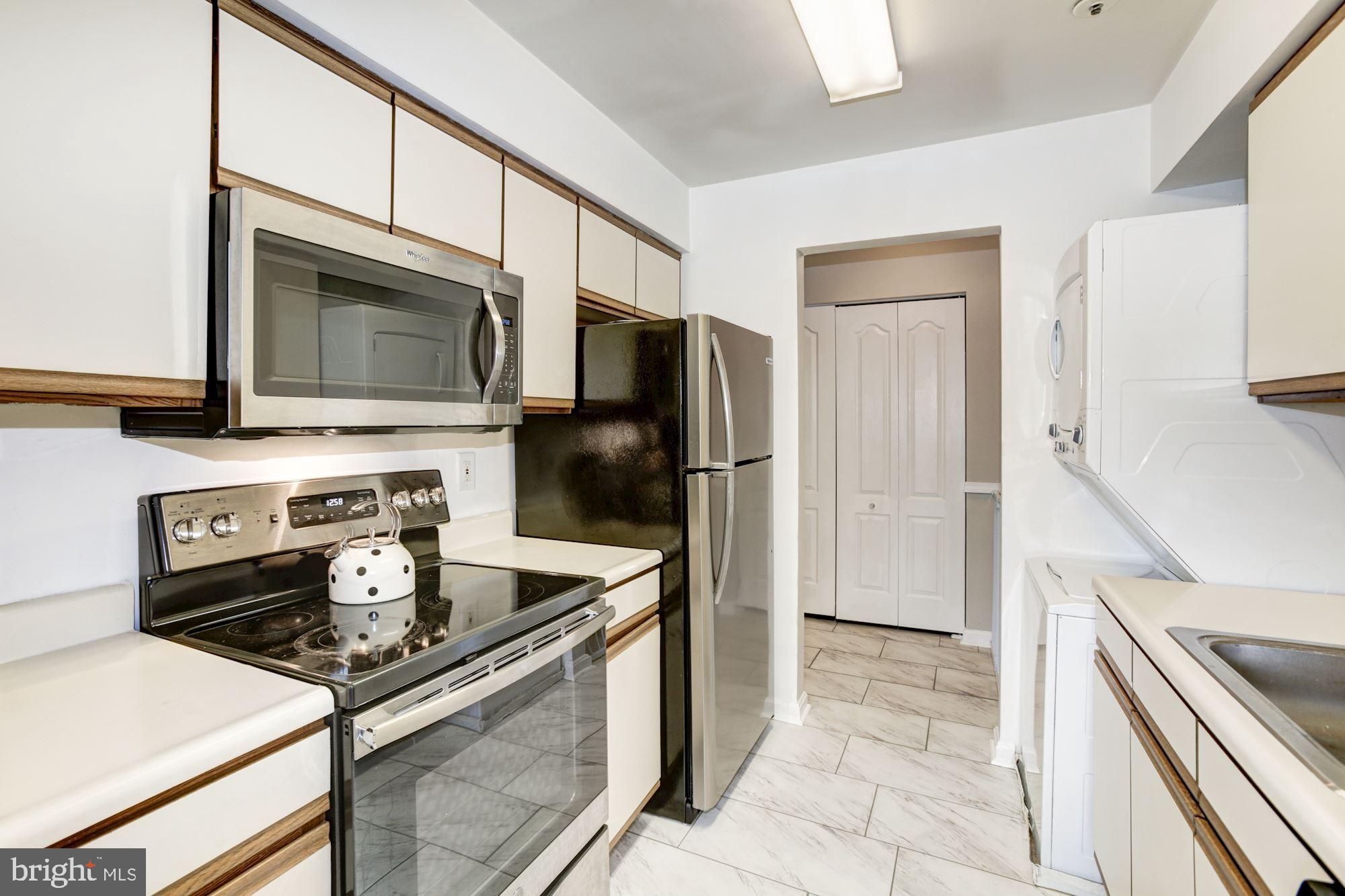 8611 Falls Run Road, Unit K Ellicott City, MD 21043 - Photo 8 of 22 Kitchen with tile floors.
