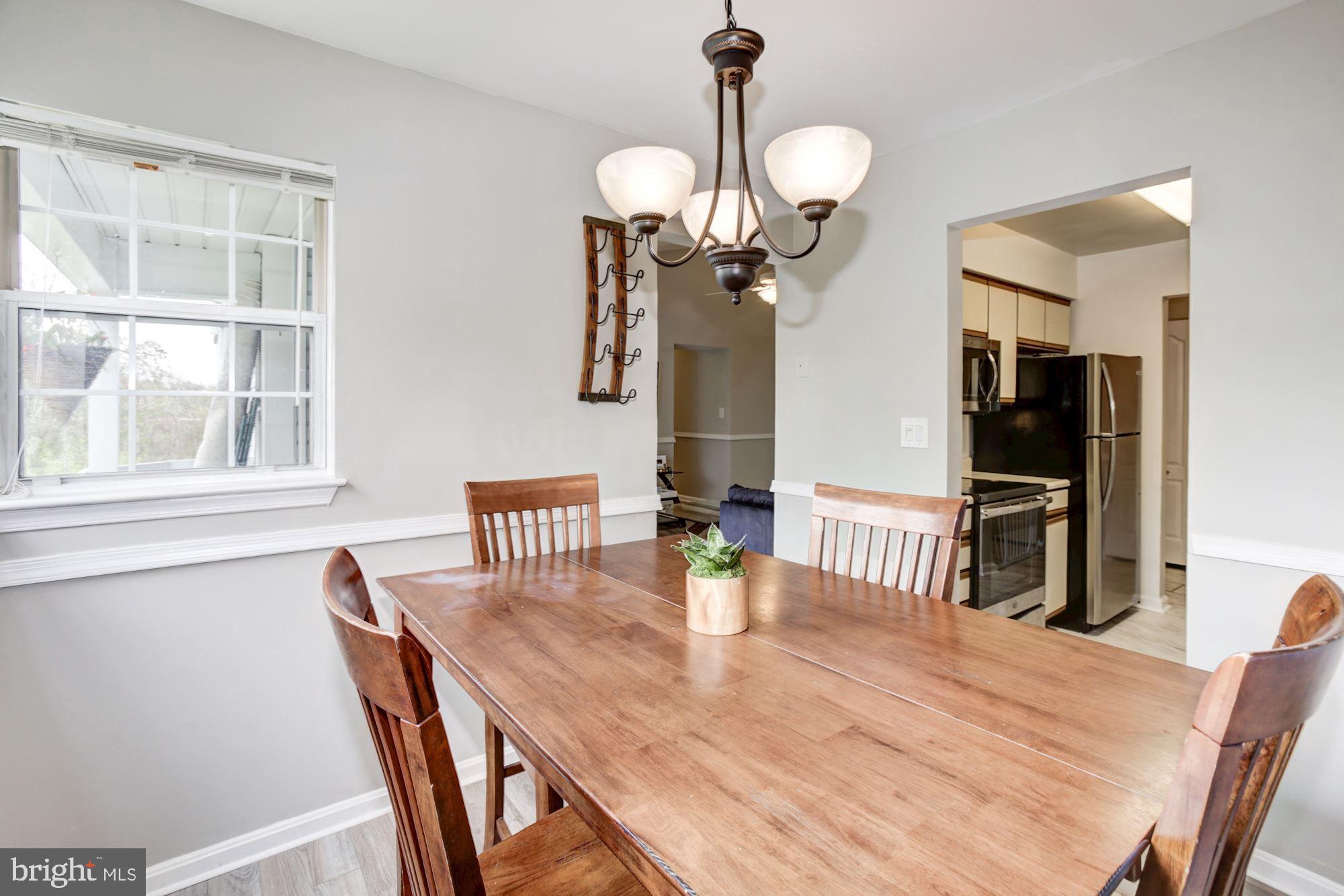 8611 Falls Run Road, Unit K Ellicott City, MD 21043 - Photo 10 of 22 Kitchen flows right into the dining room.