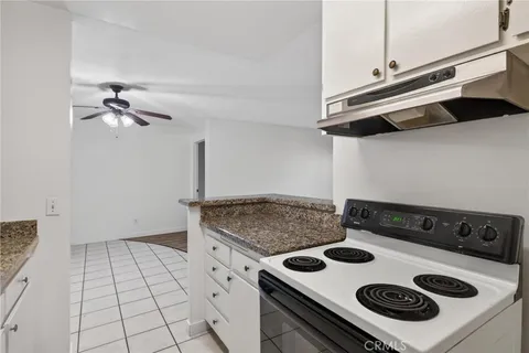 a kitchen with a stove and a sink