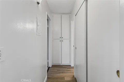 a bathroom with a sink granite countertop toilet a mirror and shower