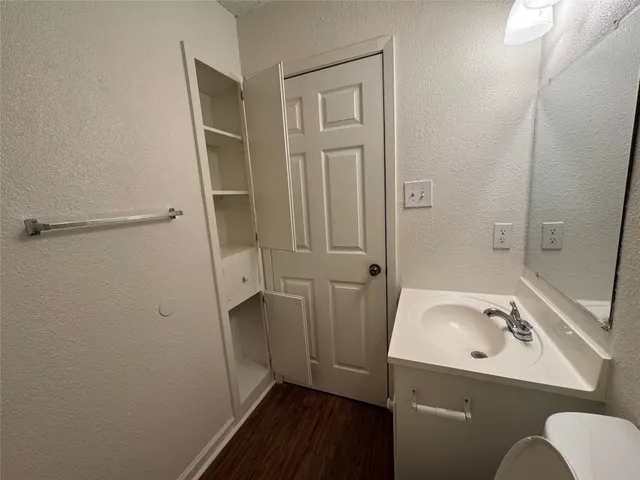a bathroom with a sink and shower