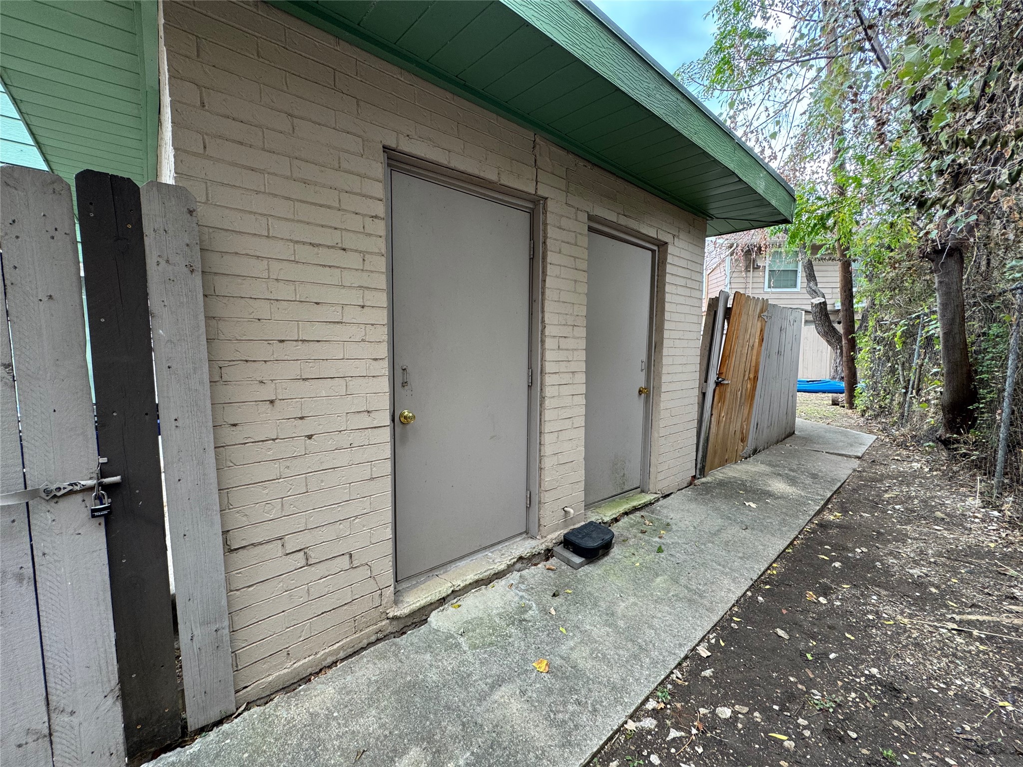 4904 West Wind Trail, Unit 102 Austin, TX 78745 - Photo 22 of 23 a view of a house with backyard and trees