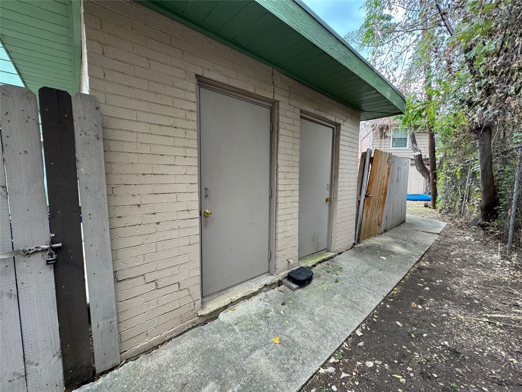 4904 West Wind Trail, Unit 102 Austin, TX 78745 - Photo 22 of 23 a view of a house with backyard and trees