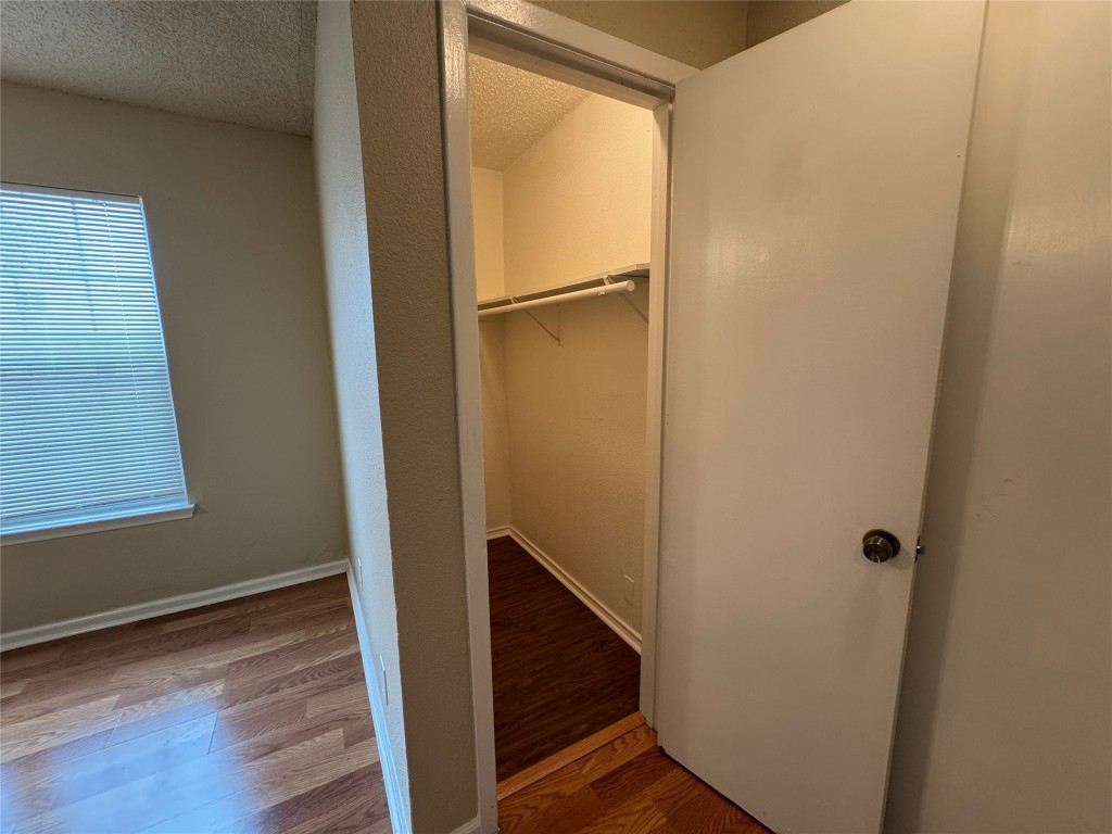 4904 West Wind Trail, Unit 102 Austin, TX 78745 - Photo 8 of 23 a view of front door with wooden floor