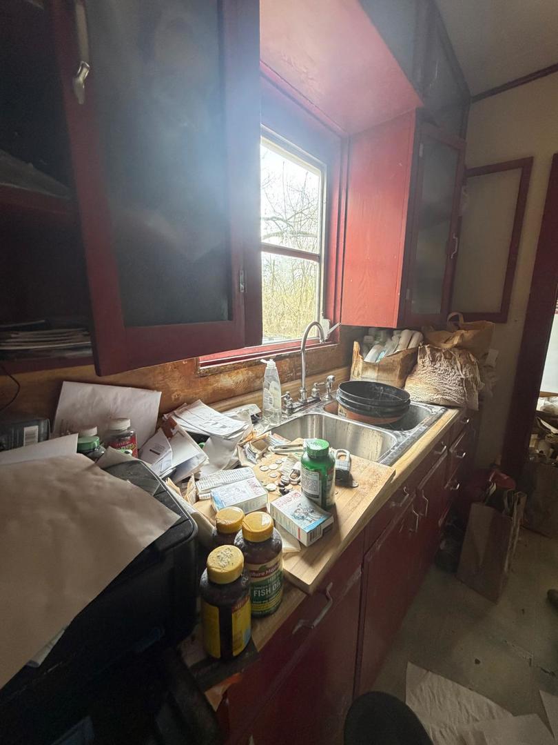 10802 West Yorkhouse Road Beach Park, IL 60087 - Photo 28 of 66 a close view of light kitchen sink stove and dining table