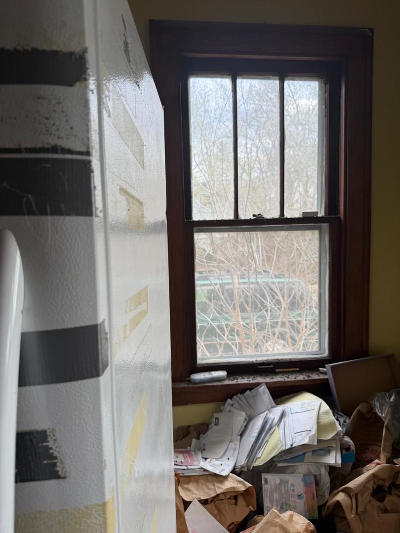 10802 West Yorkhouse Road Beach Park, IL 60087 - Photo 34 of 66 a living room with furniture and a floor to ceiling window