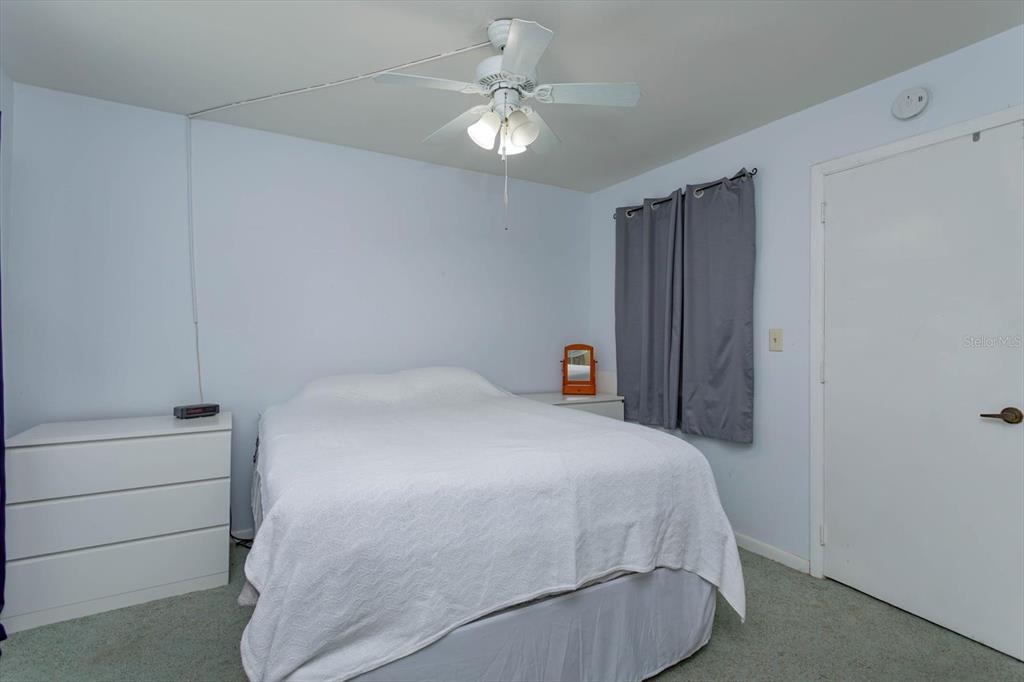 240 Orienta Point Street, Unit 240 Altamonte Springs, FL 32701 - Photo 5 of 20 a bedroom with a bed and a ceiling fan