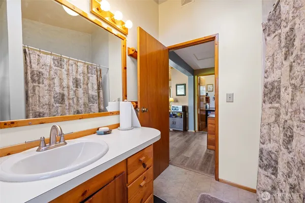 a bathroom with a sink and a mirror