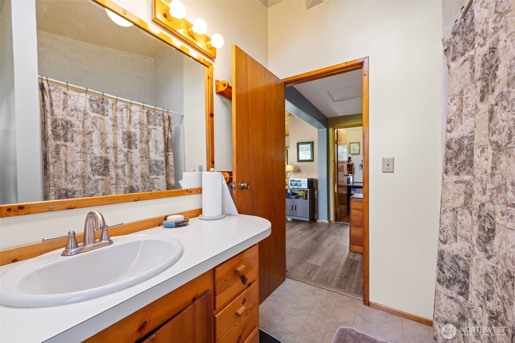 471 Barr Road Grays River, WA 98621 - Photo 15 of 40 a bathroom with a sink and a mirror