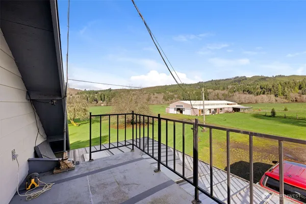 a view of a balcony with furniture