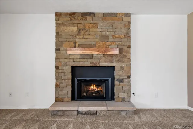 a living room with a fireplace