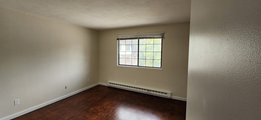 41 West Street, Unit C2 Randolph, MA 02368 - Photo 2 of 12 an empty room with a window