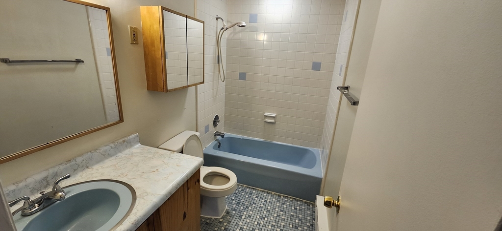 41 West Street, Unit C2 Randolph, MA 02368 - Photo 4 of 12 a bathroom with a tub a sink and a shower