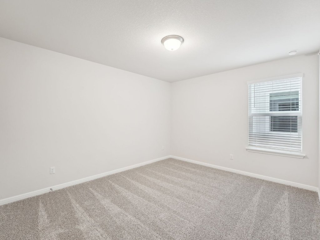 165 Calcite Road, Unit 1 Kyle, TX 78640 - Photo 11 of 15 a view of an empty room with a window