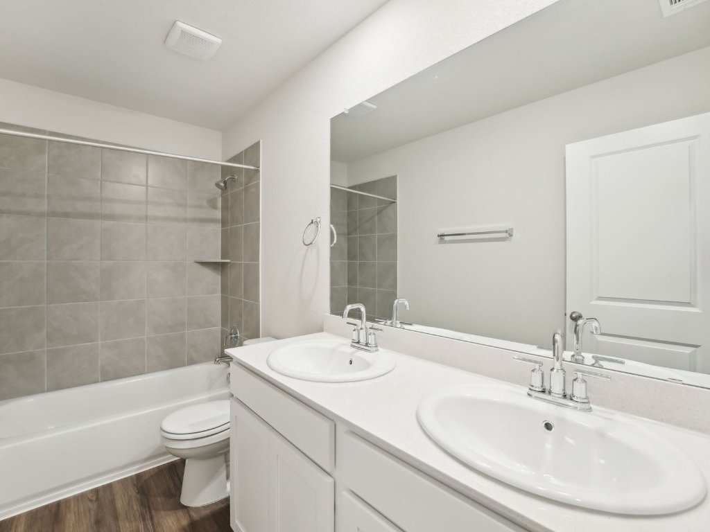 165 Calcite Road, Unit 1 Kyle, TX 78640 - Photo 12 of 15 a bathroom with a sink a toilet and shower