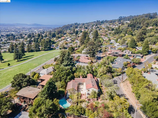 an aerial view of a house with a yard