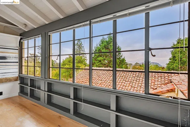 a spacious bathroom with a tub sink and mirror
