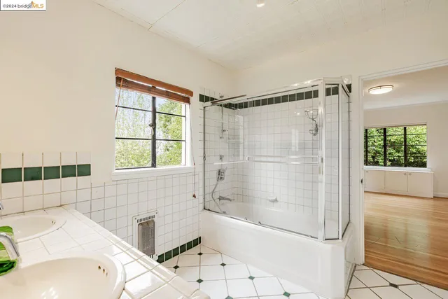 a room with a wooden floor and cabinets