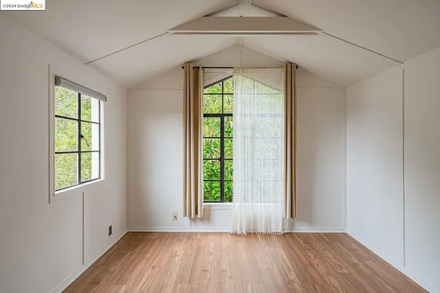 a view of a house with couches and deck