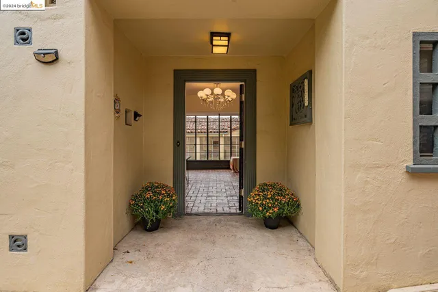 a living room with fireplace furniture and a wooden floor