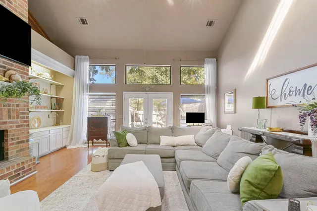 a living room with furniture windows and a fireplace