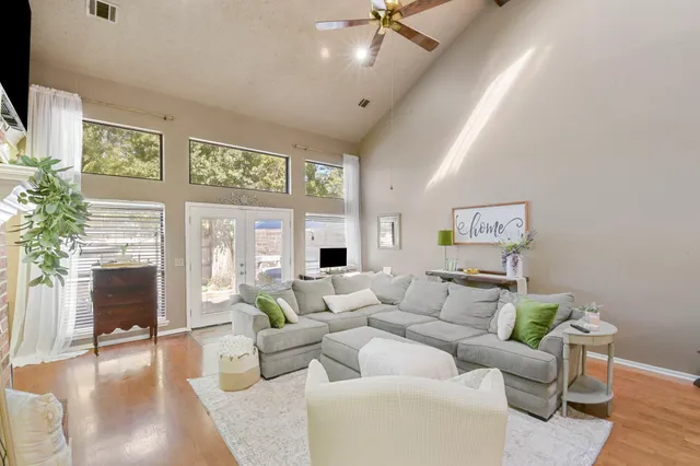 a living room with furniture and a fireplace
