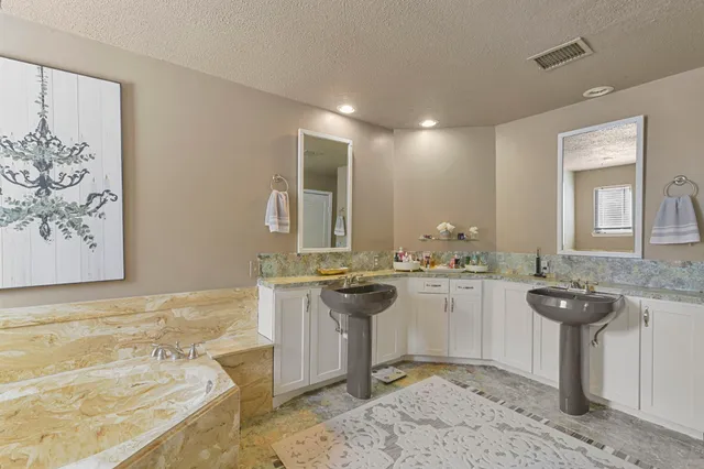 a bathroom with a sink a washer and dryer