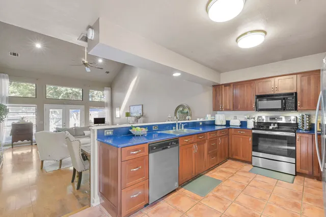 a kitchen with lots of counter top space and appliances