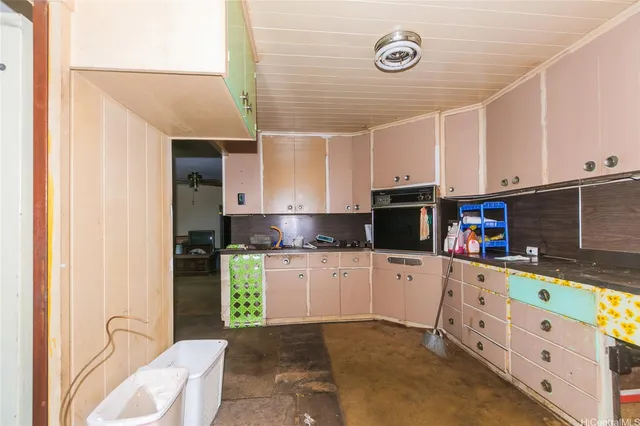 a kitchen with stainless steel appliances a refrigerator sink and stove