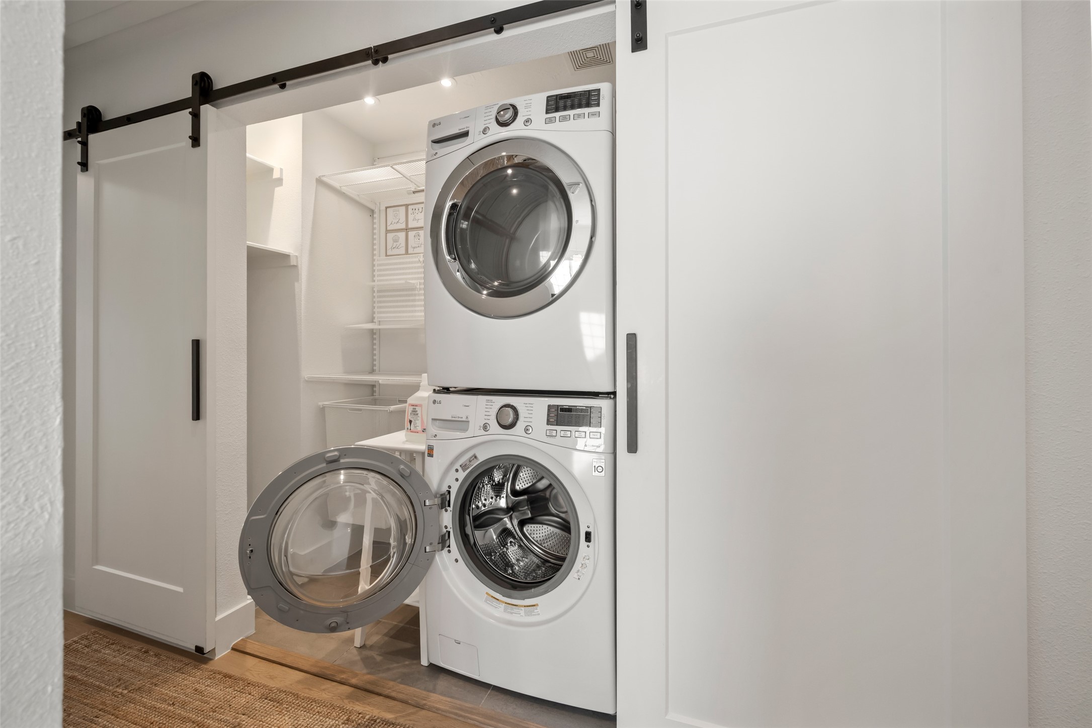 258 Sentry Maple Place The Woodlands, TX 77382 - Photo 19 of 27 a utility room with dryer and washer