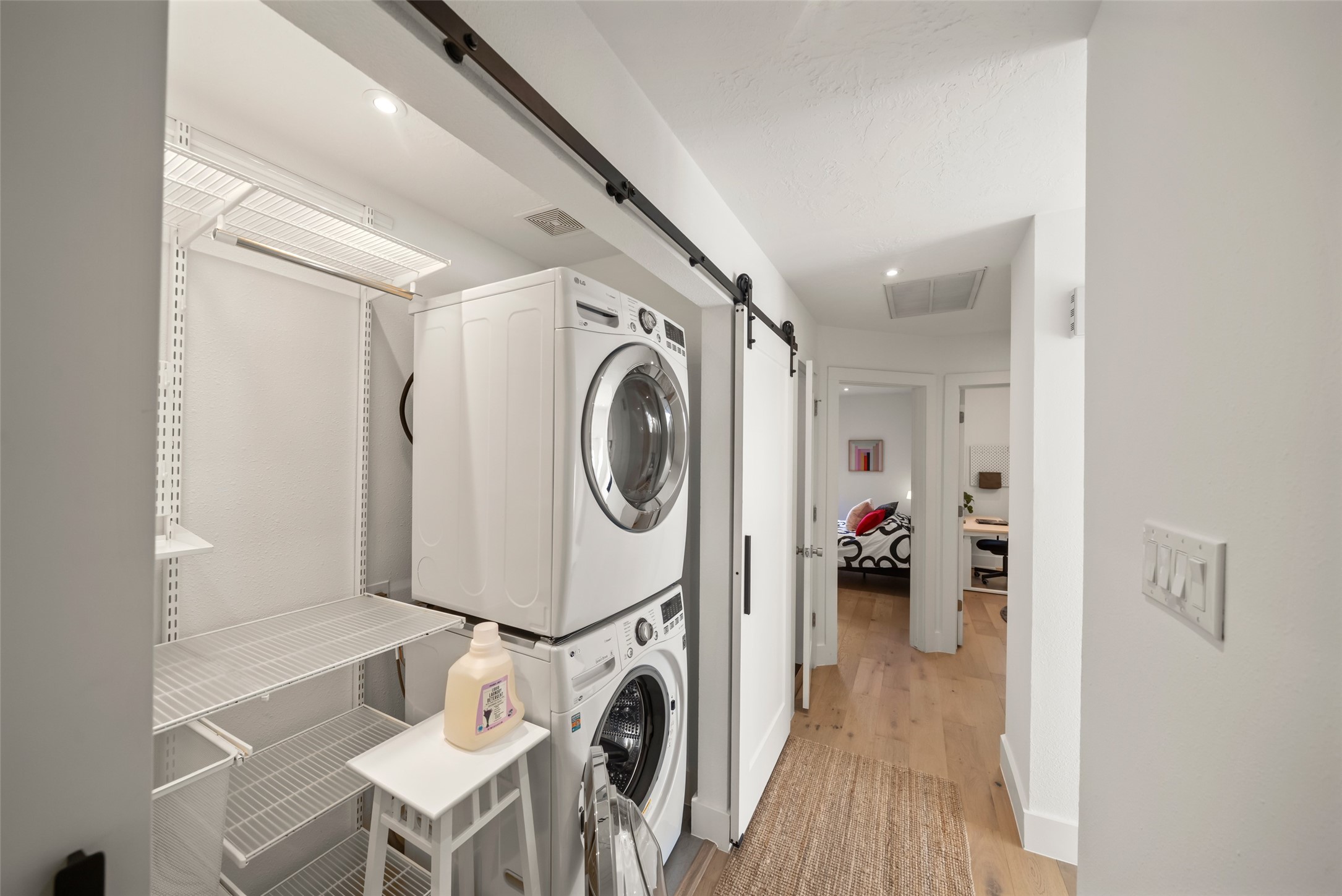 258 Sentry Maple Place The Woodlands, TX 77382 - Photo 20 of 27 a view of a storage & utility room with washer and dryer