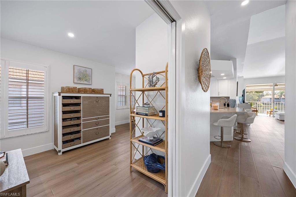 2450 Old Groves Road, Unit 201 Naples, FL 34109 - Photo 17 of 32 a view of walk in closet with clothes and shoes