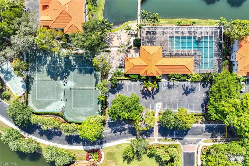 2450 Old Groves Road, Unit 201 Naples, FL 34109 - Photo 31 of 32 a view of a swimming pool with a patio