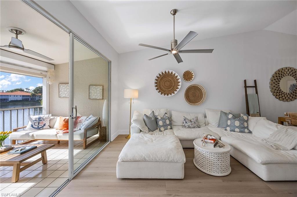 2450 Old Groves Road, Unit 201 Naples, FL 34109 - Photo 4 of 32 a living room with furniture and a window