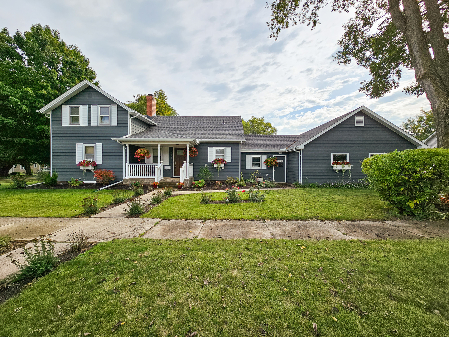 301 Adams Street Oregon, IL 61061 - Photo 1 of 50 a front view of a house with a yard and green space