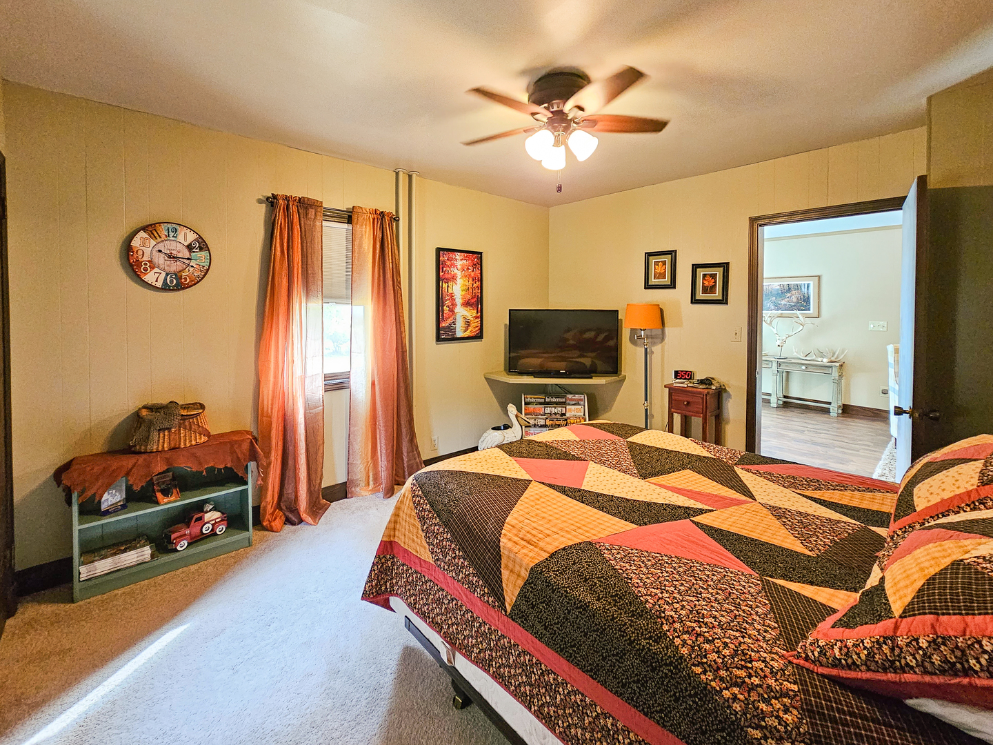 301 Adams Street Oregon, IL 61061 - Photo 12 of 50 a bedroom with a bed and a chandelier