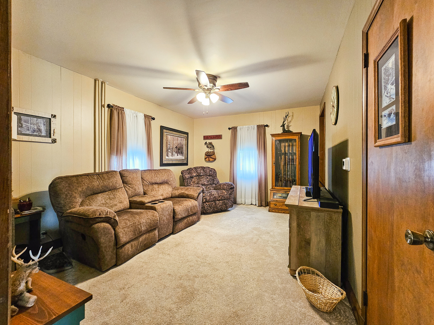 301 Adams Street Oregon, IL 61061 - Photo 13 of 50 a living room with furniture ceiling fan and a rug