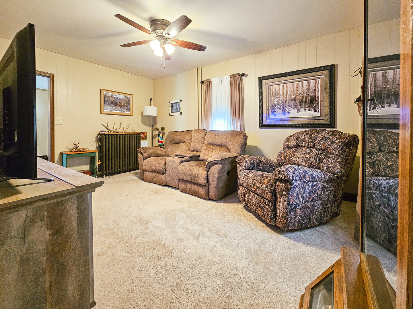 301 Adams Street Oregon, IL 61061 - Photo 14 of 50 a living room with furniture and a flat screen tv