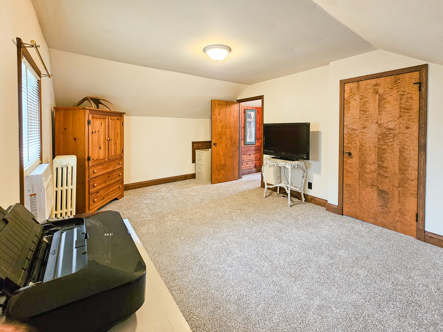 301 Adams Street Oregon, IL 61061 - Photo 32 of 50 a bedroom with furniture and a flat screen tv