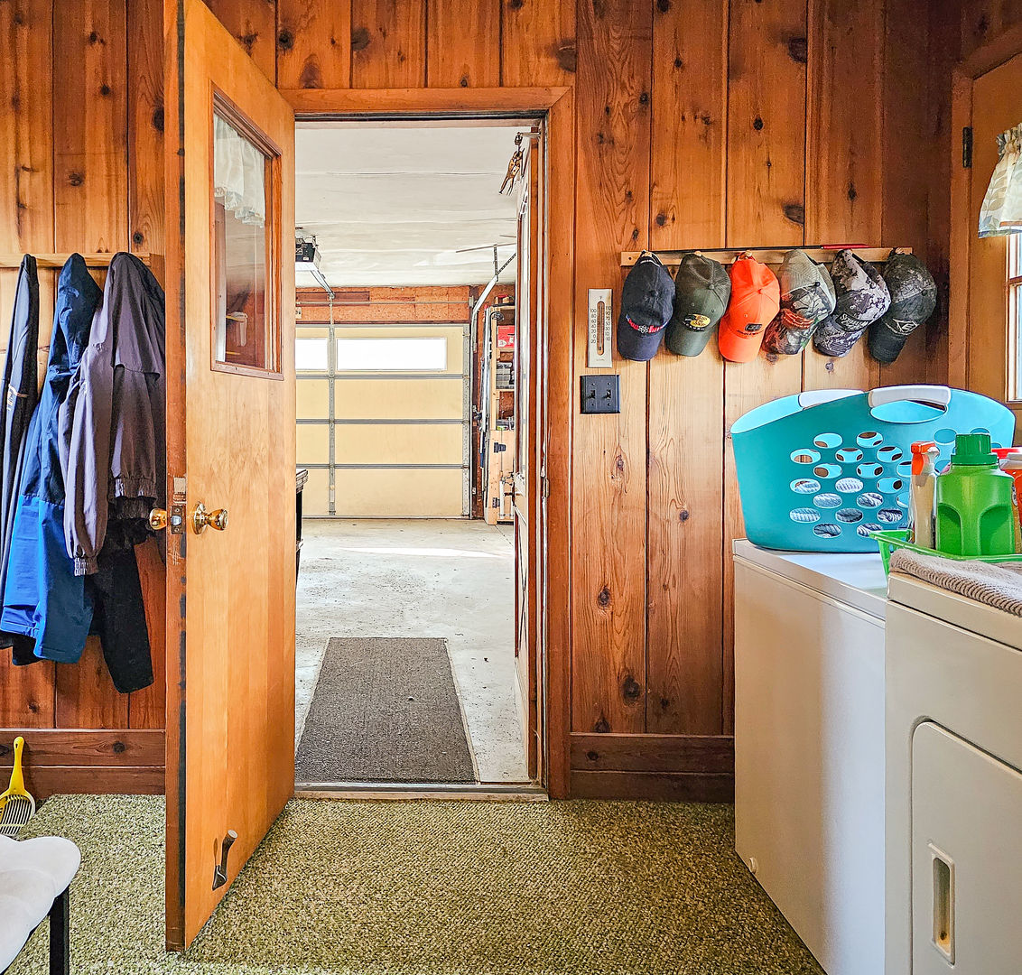 301 Adams Street Oregon, IL 61061 - Photo 36 of 50 a view of walk in closet with wooden floor