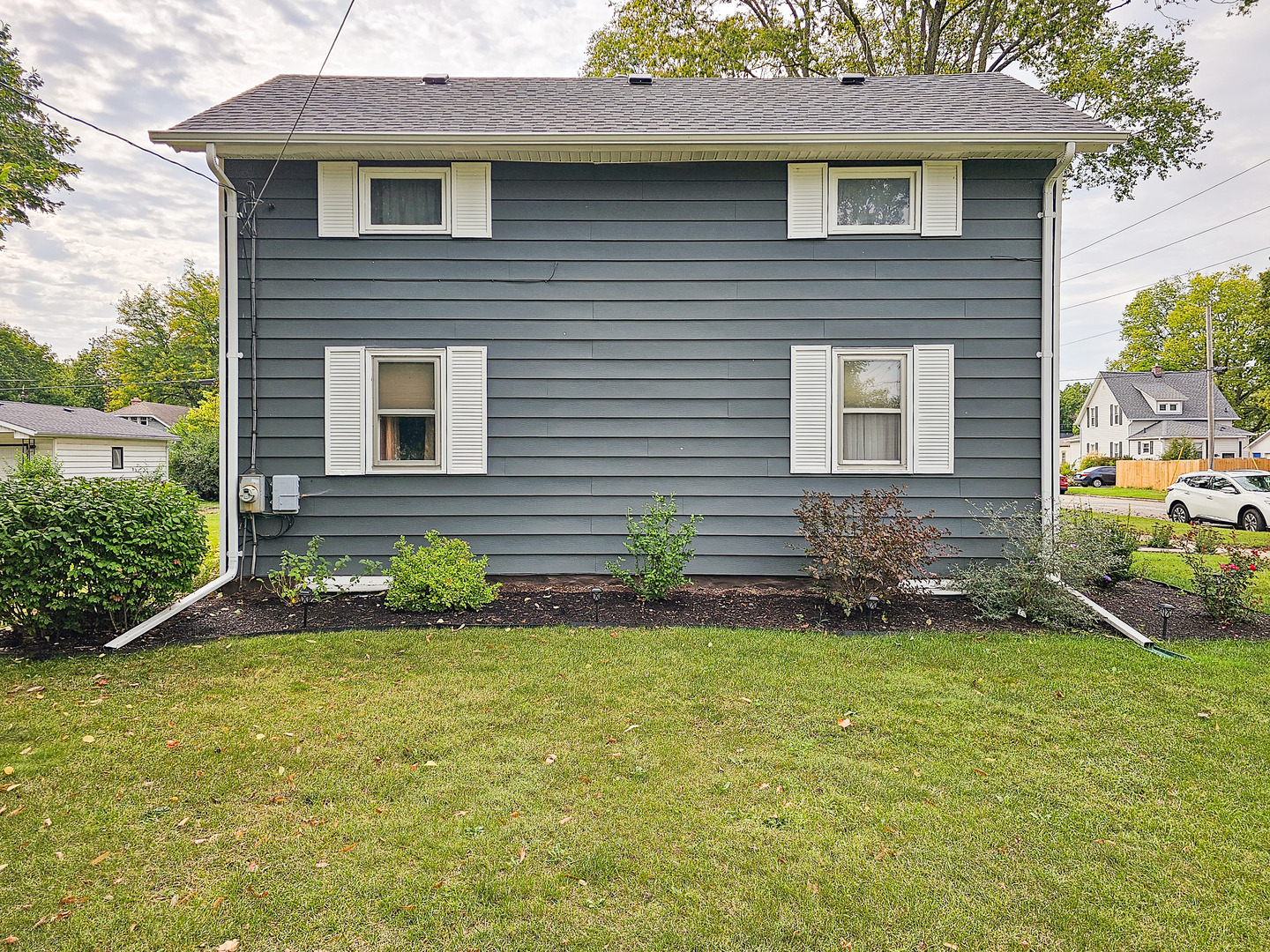 301 Adams Street Oregon, IL 61061 - Photo 38 of 50 a front view of a house with a yard and garage