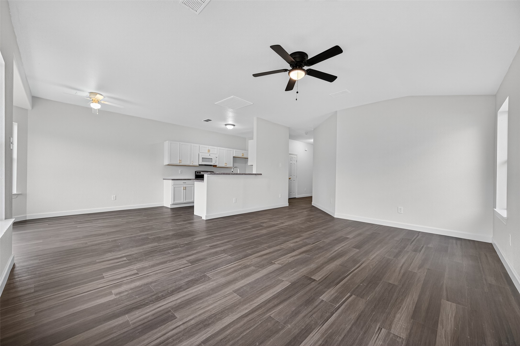 3322 Brackenfern Road Katy, TX 77449 - Photo 11 of 38 a view of a kitchen with wooden floor and a sink